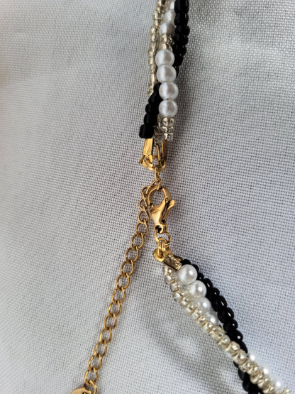 Collier tressé noir et doré