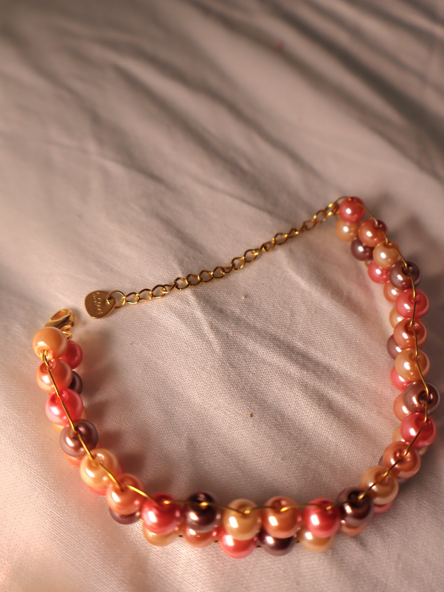 Petit bracelet rose tressé